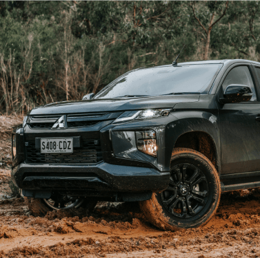 Mitsubishi 4x4 on a dirt road